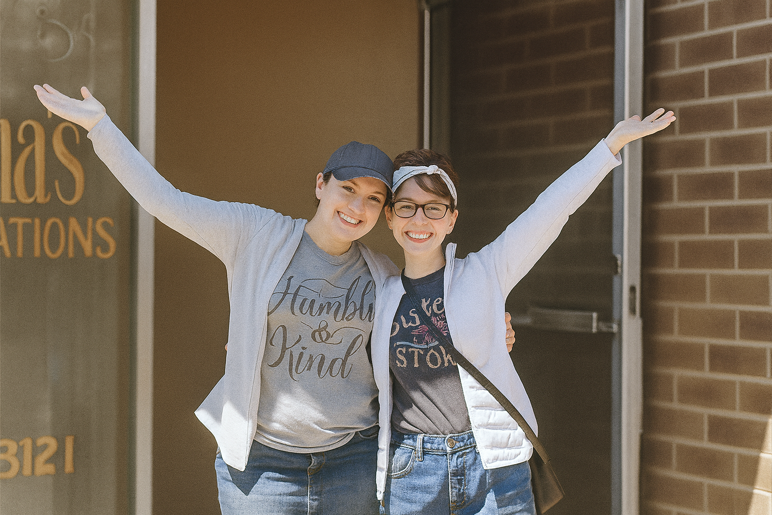 Abby and Grace welcoming guests